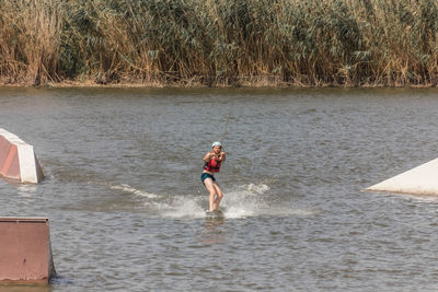 Man kite boarding in river