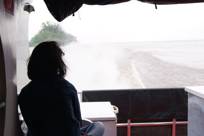 Rear view of woman looking at sea