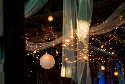 Wedding reception lighting at a barn wedding in the summer