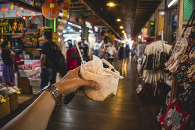 People having food at market