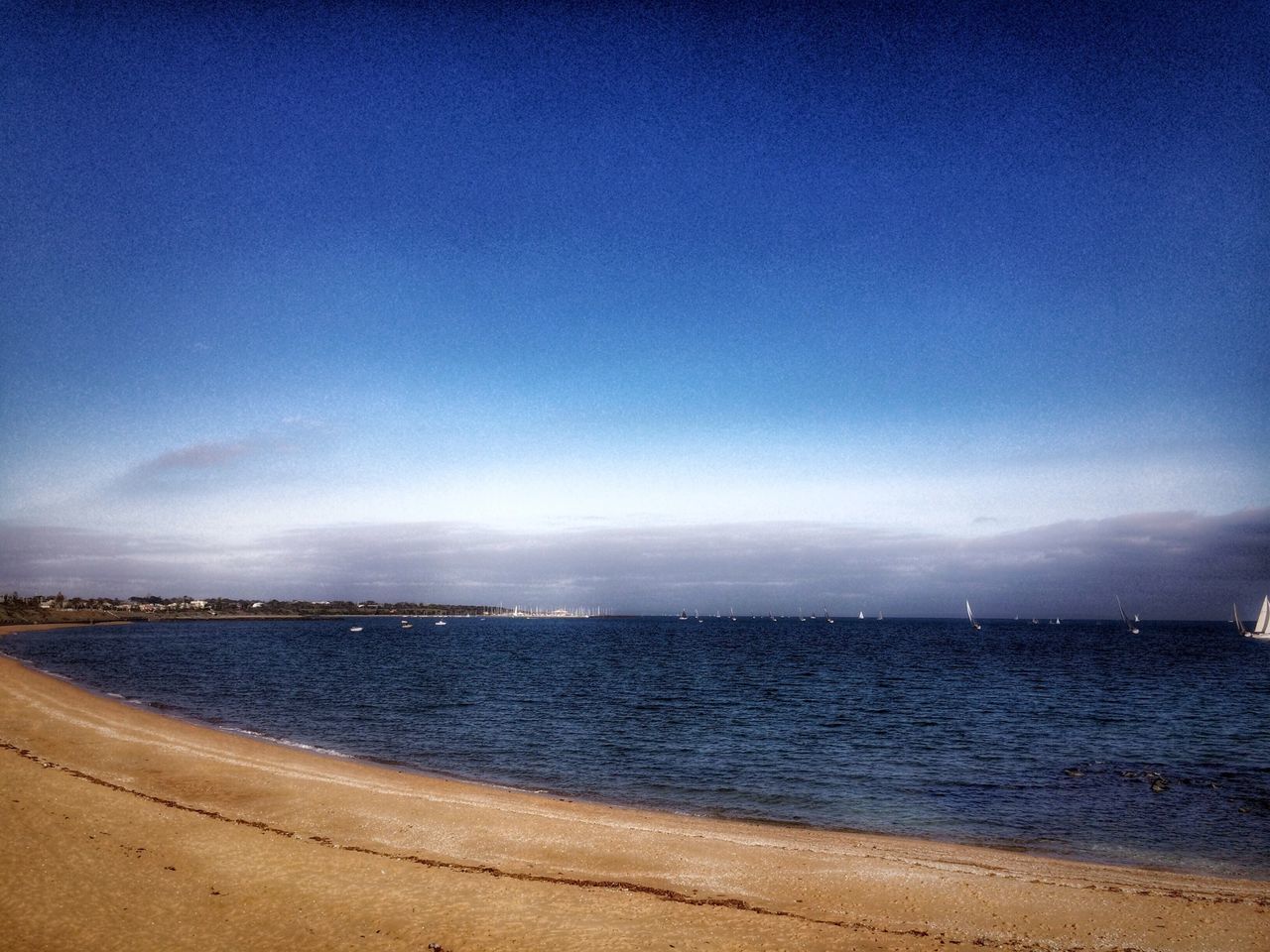 sea, water, beach, tranquil scene, horizon over water, tranquility, scenics, blue, shore, sand, sky, beauty in nature, nature, copy space, idyllic, coastline, calm, outdoors, clear sky, ocean