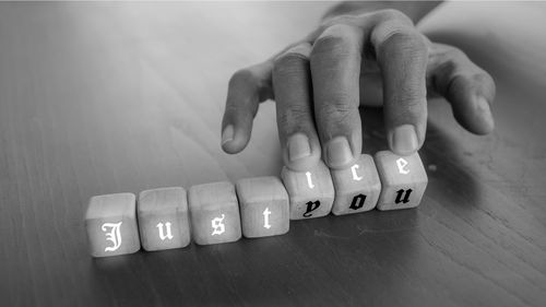 Close-up of hand on table