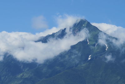 Low angle view of mountain range against sky