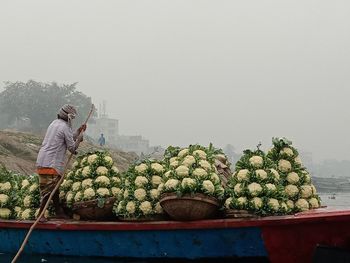 Man having food against clear sky