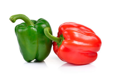 Close-up of bell peppers against white background