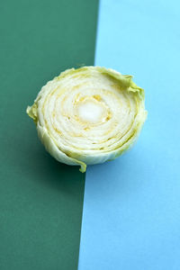 Directly above shot of cabbage on colored background