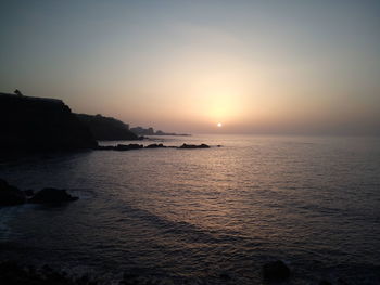 Scenic view of sea against clear sky during sunset