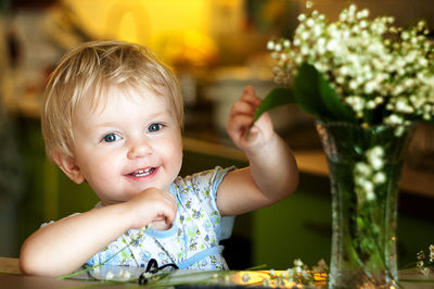 Portrait of happy boy eating food