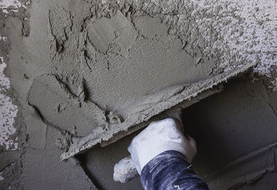 Low section of man standing on rock