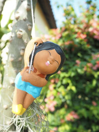 Close-up of boy holding toy outdoors