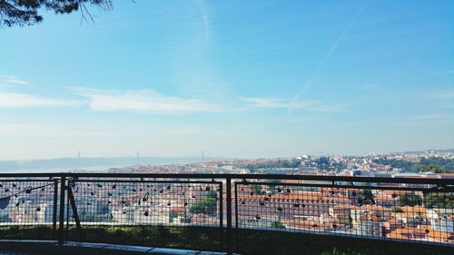 High angle shot of townscape against blue sky