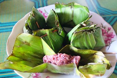 Close-up of fruits and leaves on table