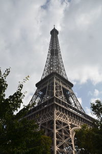 Low angle view of tower against cloudy sky