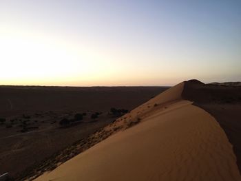 Scenic view of desert against clear sky