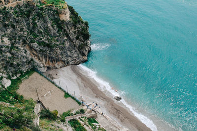 Aerial view of beach and rocky coastline