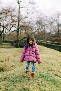 Full length of a girl standing on land