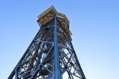 Low angle view of tower against blue sky