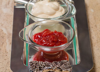 High angle view of strawberries in glass jar on table