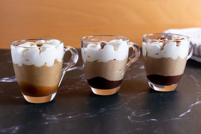 Assortment of mini chocolate desserts in the glass. mini choloate desserts on a rustic background