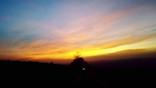 Scenic view of landscape at sunset