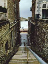 Narrow alley amidst buildings in city