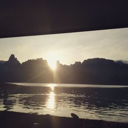 Scenic view of lake against sky during sunset