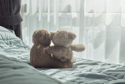 Stuffed toy on bed at home