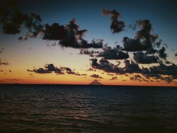 Scenic view of sea against sky at sunset