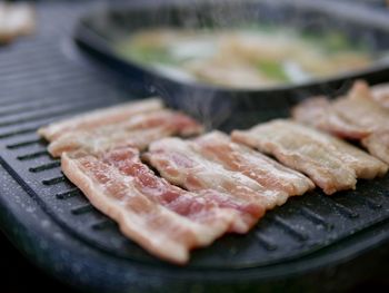 Close-up of meat on barbecue grill