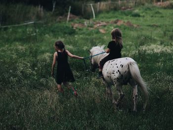 Children standing on field