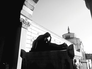Low angle view of a statue against building
