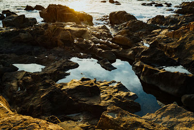 High angle view of rocks by sea