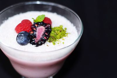 Close-up of yoghurt with berry fruits