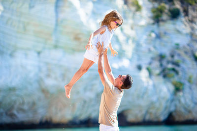 Side view of woman standing in water