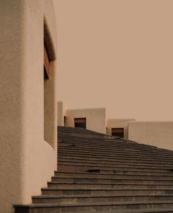 Low angle view of steps on building against clear sky