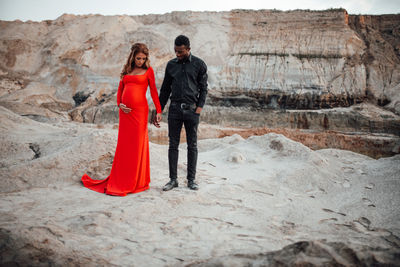 Young couple standing on rock