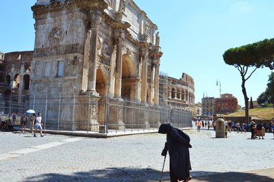 Tourists in front of building