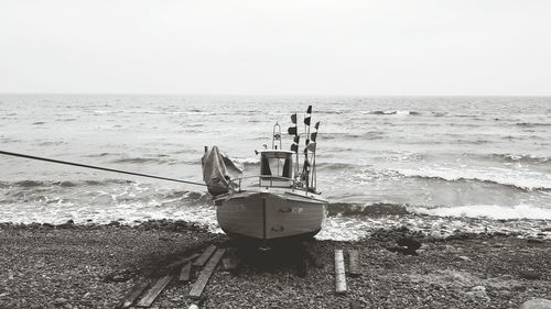 Nautical vessel on sea against clear sky