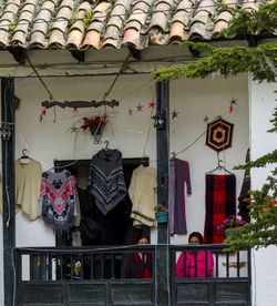 Low angle view of clothes hanging outside house