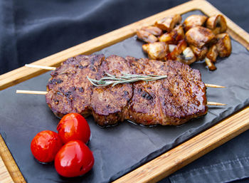 High angle view of meat on barbecue grill