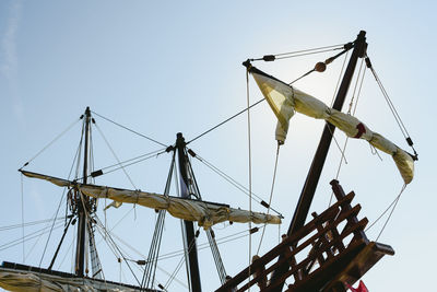 Low angle view of sailboat against clear sky