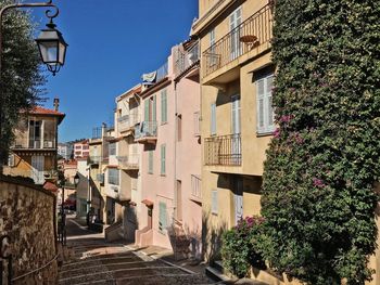 Street amidst buildings against sky