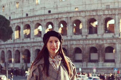 Portrait of smiling woman in city