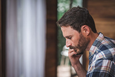 Portrait of young man looking away