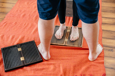 Low section of man standing on floor