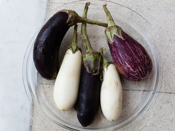 Directly above shot of eggplants in glass plate on table