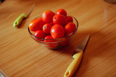 High angle view of cherries in bowl on table