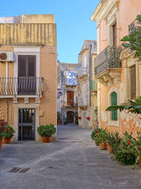 Alley amidst buildings in city