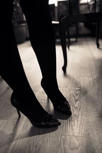 Low section of woman in high heels