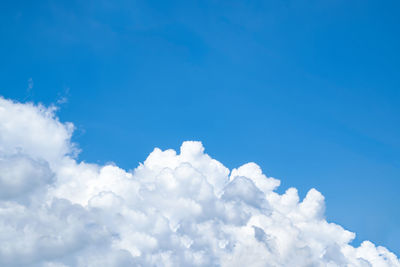 Low angle view of cloudscape against blue sky